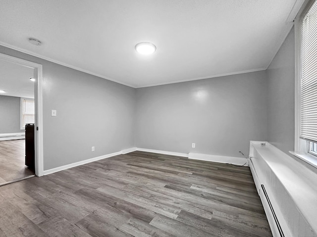 38 Hammond St, Vernon, CT 06066 - spare room featuring baseboard heating, crown molding, healthy amount of natural light, wood finished floors, and a smoke detector
