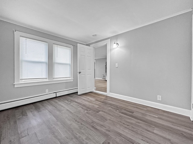 38 Hammond St, Vernon, CT 06066 - unfurnished bedroom with crown molding, dark wood finished floors, and a baseboard heating unit