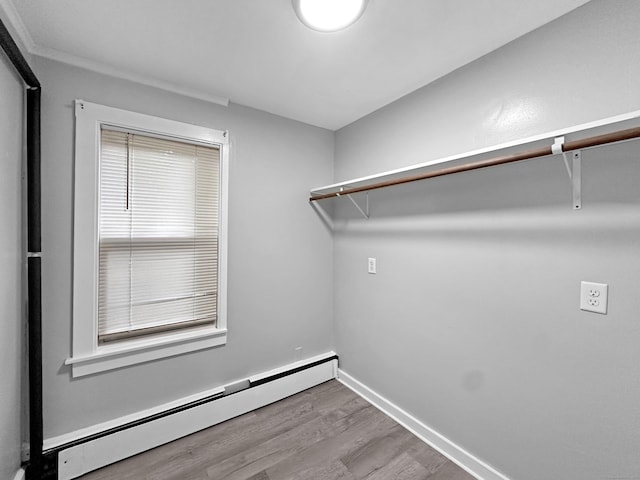 38 Hammond St, Vernon, CT 06066 - walk in closet featuring baseboard heating and wood finished floors