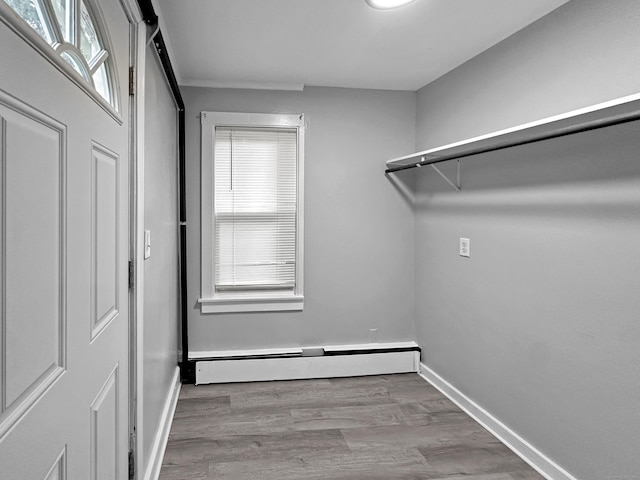 38 Hammond St, Vernon, CT 06066 - washroom with a baseboard radiator, wood finished floors, and healthy amount of natural light