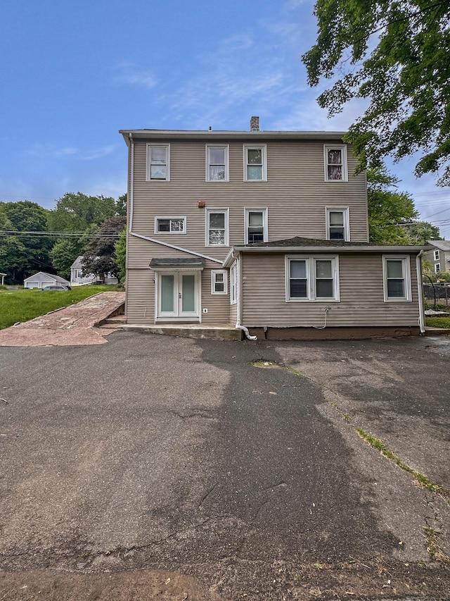 38 Hammond St, Vernon, CT 06066 - rear view of property with a chimney