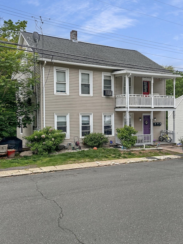 38 Hammond St, Vernon, CT 06066 - view of property featuring covered porch, a chimney, and roof with shingles