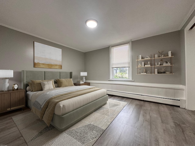 38 Hammond St, Vernon, CT 06066 - bedroom featuring a baseboard radiator, wood finished floors, and crown molding