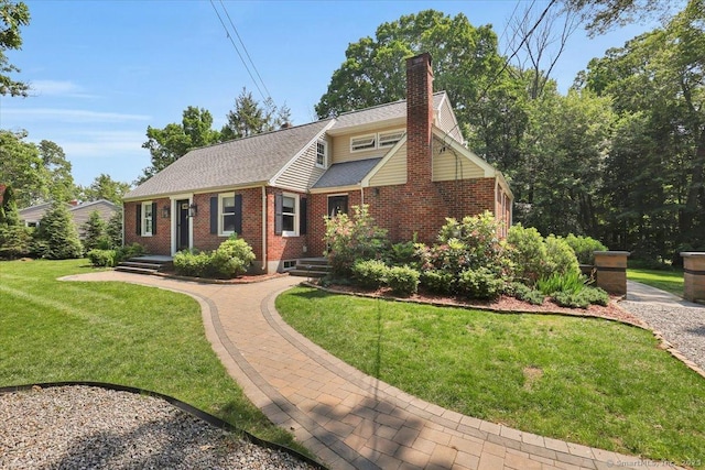 57 Whitney Rd, Columbia, CT 06237 - view of front of home with brick siding, a chimney, a front lawn, and roof with shingles
