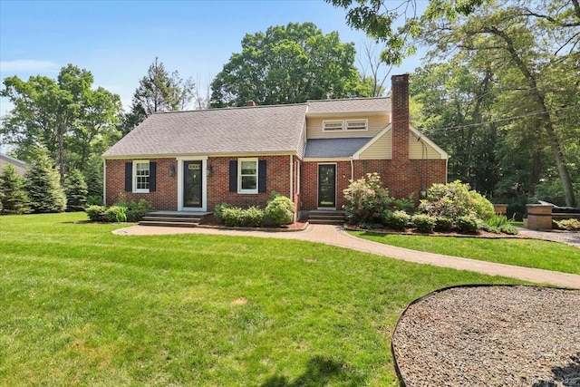 57 Whitney Rd, Columbia, CT 06237 - view of front facade with a chimney, a front lawn, brick siding, and a shingled roof