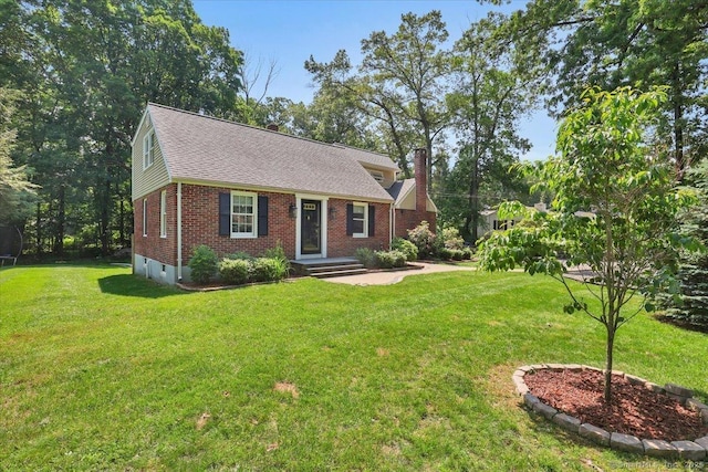 57 Whitney Rd, Columbia, CT 06237 - view of front facade with brick siding, a front yard, a chimney, and a shingled roof