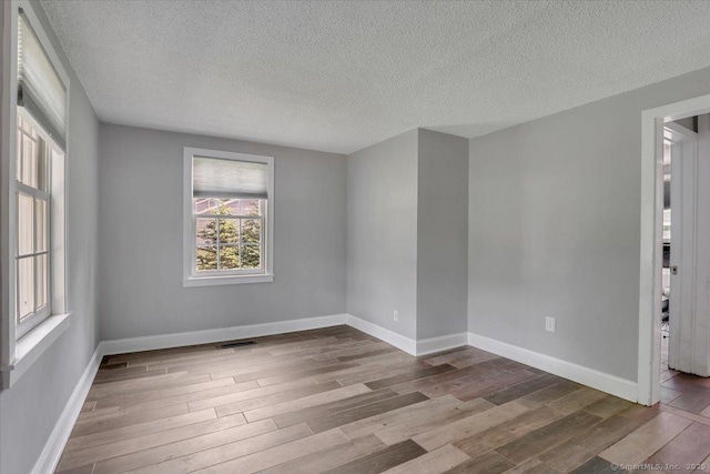 57 Whitney Rd, Columbia, CT 06237 - spare room with wood finished floors and a textured ceiling