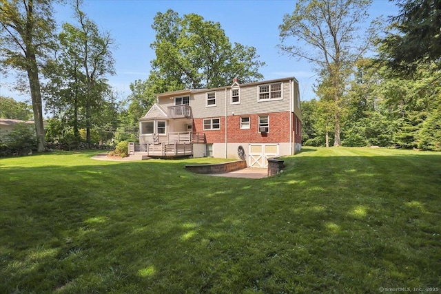 57 Whitney Rd, Columbia, CT 06237 - back of house featuring a yard, brick siding, a balcony, and a wooden deck