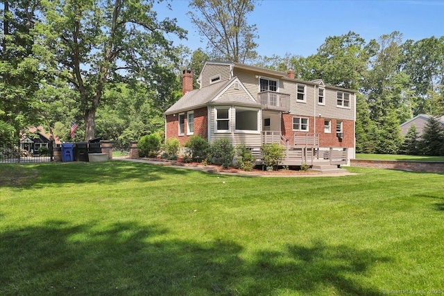 57 Whitney Rd, Columbia, CT 06237 - rear view of house featuring a chimney, brick siding, and a yard