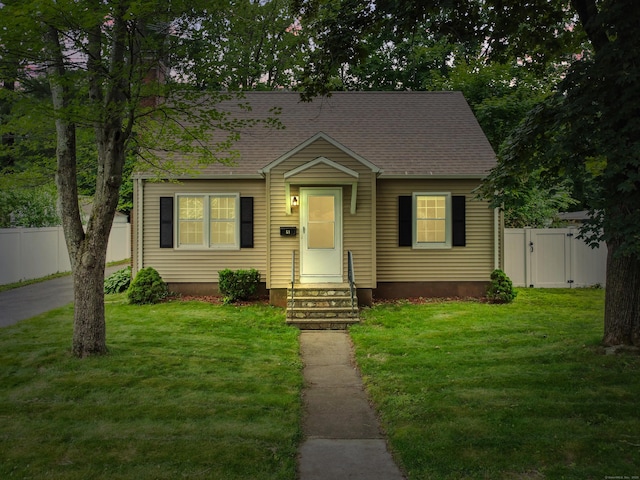 51 Goodwin St, Manchester, CT 06040 - view of front facade with roof with shingles, entry steps, and a gate