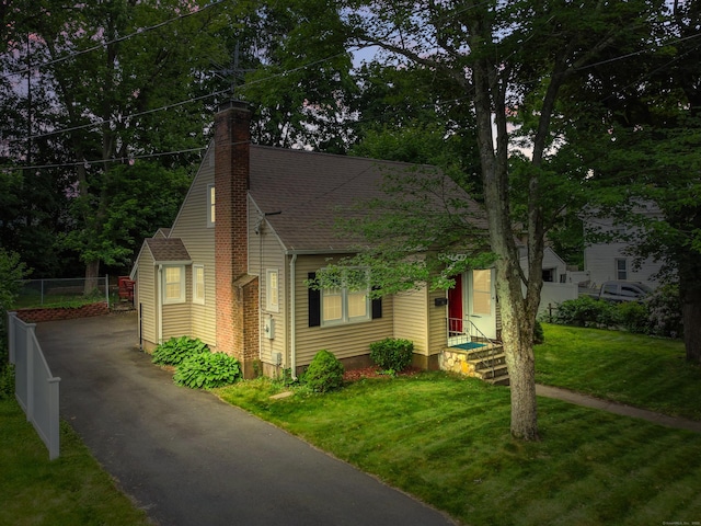 51 Goodwin St, Manchester, CT 06040 - bungalow featuring asphalt driveway, a chimney, and a shingled roof