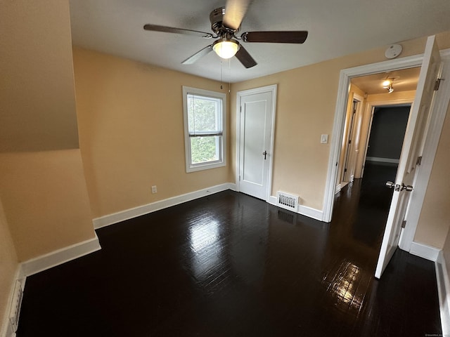 82 Trowbridge Pl, Naugatuck, CT 06770 - unfurnished bedroom with dark wood-style floors, a ceiling fan, and a closet