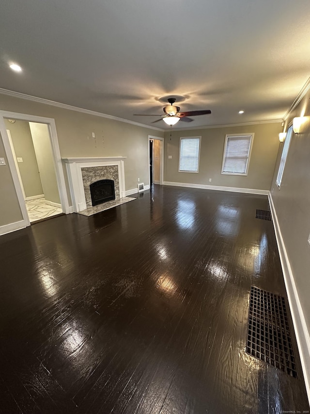 82 Trowbridge Pl, Naugatuck, CT 06770 - unfurnished living room featuring hardwood / wood-style flooring, a fireplace with flush hearth, ceiling fan, and ornamental molding