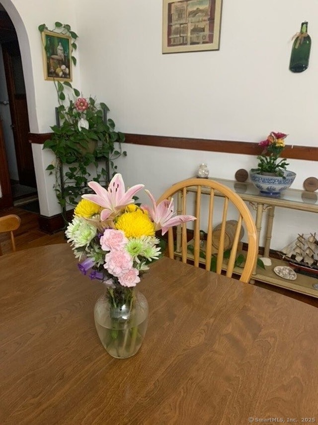 1085 Hamilton Ave, Waterbury, CT 06706 - dining space featuring arched walkways and wood finished floors
