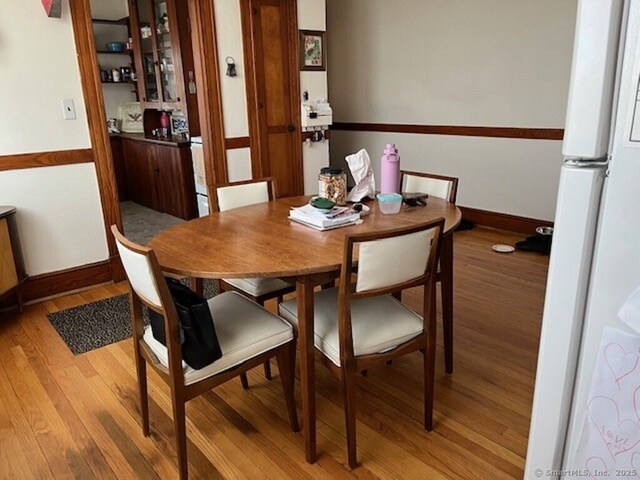 1085 Hamilton Ave, Waterbury, CT 06706 - dining space with light wood-type flooring and baseboards