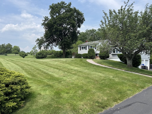 20 Celestial Ln, Wallingford, CT 06492 - view of front of house featuring a front yard and a chimney