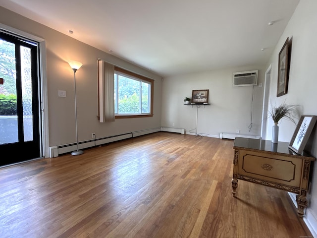 365 Ruth St, Bridgeport, CT 06606 - entryway featuring a wall unit AC, wood finished floors, a baseboard radiator, and baseboard heating