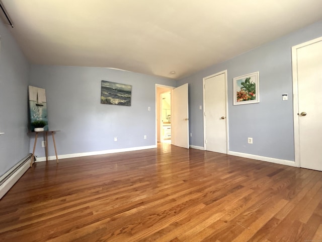 365 Ruth St, Bridgeport, CT 06606 - spare room featuring wood finished floors and a baseboard heating unit