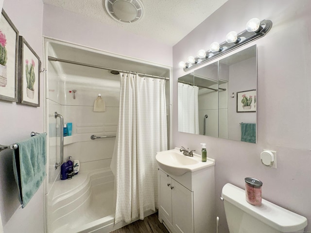 11 Polk Ln, Windsor Locks, CT 06096 - full bathroom featuring vanity, a shower with shower curtain, a textured ceiling, and wood finished floors