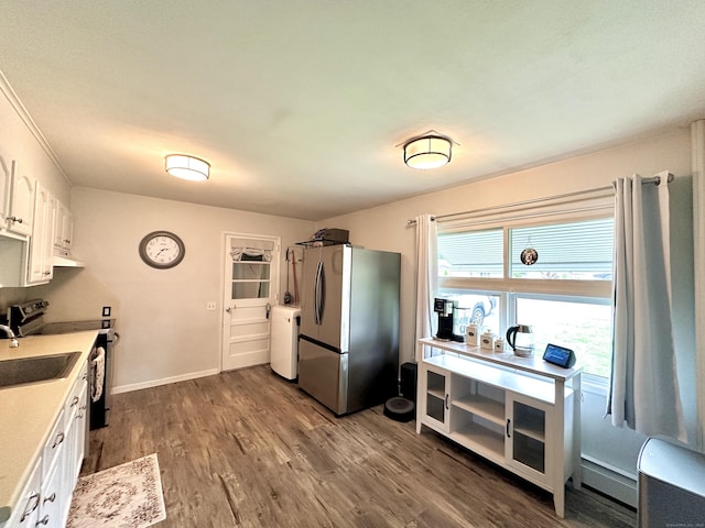11 Polk Ln, Windsor Locks, CT 06096 - kitchen featuring stainless steel appliances, light countertops, white cabinetry, dark wood-style flooring, and under cabinet range hood