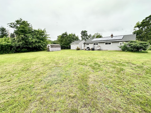 11 Polk Ln, Windsor Locks, CT 06096 - view of green lawn featuring a storage shed