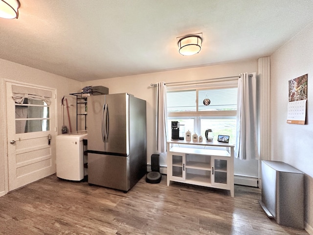 11 Polk Ln, Windsor Locks, CT 06096 - kitchen featuring freestanding refrigerator, washer / clothes dryer, wood finished floors, and a baseboard radiator