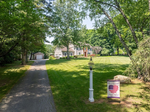 427 Long Mountain Rd, New Milford, CT 06776 - view of front of property featuring a garage, an outbuilding, and a front yard