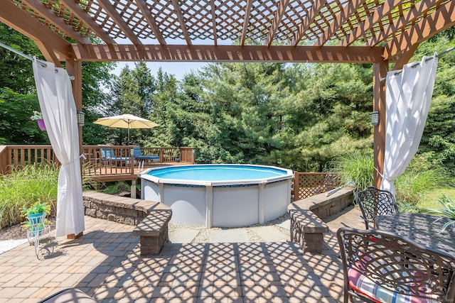 427 Long Mountain Rd, New Milford, CT 06776 - view of patio featuring outdoor dining space, a pergola, a wooden deck, and view of scattered trees