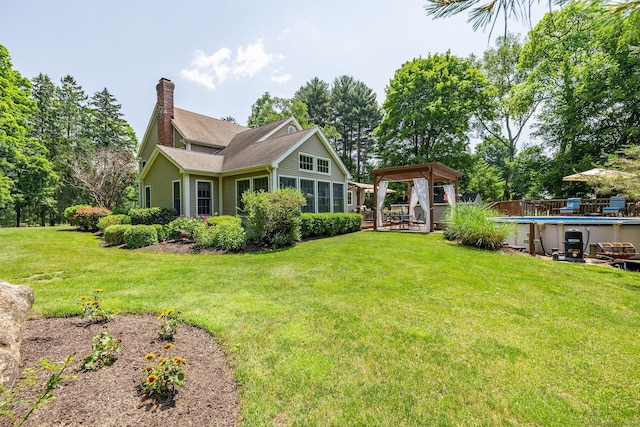 427 Long Mountain Rd, New Milford, CT 06776 - back of property with a gazebo, a chimney, an outdoor pool, and a lawn