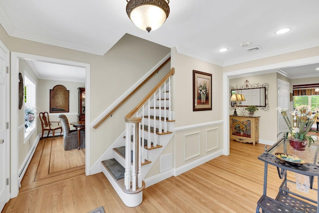 427 Long Mountain Rd, New Milford, CT 06776 - staircase featuring a baseboard heating unit, wood finished floors, ornamental molding, and recessed lighting