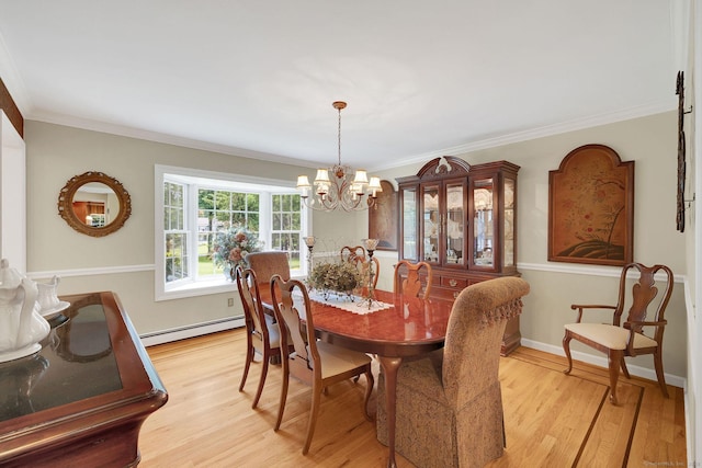 427 Long Mountain Rd, New Milford, CT 06776 - dining room with a baseboard heating unit, light wood-style flooring, a chandelier, and crown molding