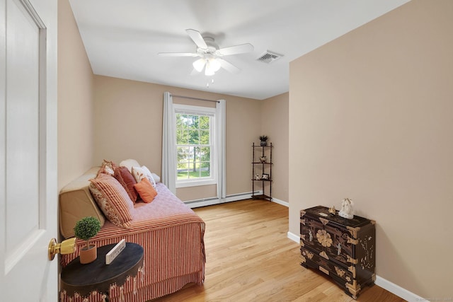 427 Long Mountain Rd, New Milford, CT 06776 - living area with baseboard heating, light wood-style floors, and a ceiling fan
