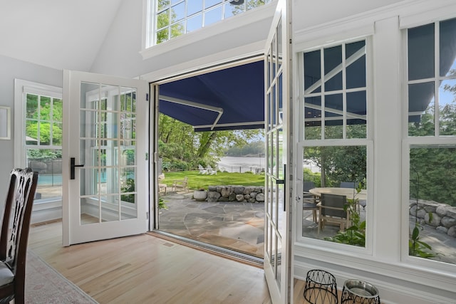 21 Oak Ridge Park, Westport, CT 06880 - doorway with wood finished floors, a water view, and high vaulted ceiling