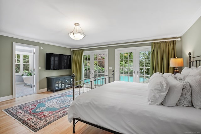 21 Oak Ridge Park, Westport, CT 06880 - bedroom featuring french doors, ornamental molding, access to exterior, wood finished floors, and ensuite bathroom