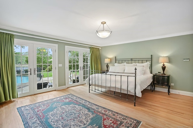 21 Oak Ridge Park, Westport, CT 06880 - bedroom featuring french doors, access to outside, crown molding, and wood finished floors