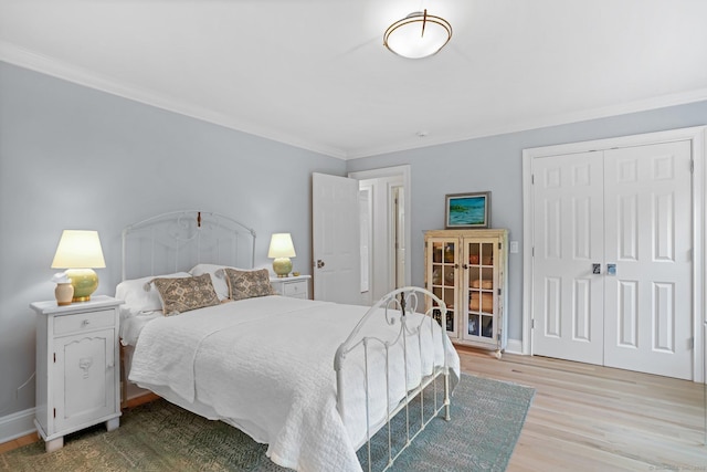 21 Oak Ridge Park, Westport, CT 06880 - bedroom with light wood finished floors, ornamental molding, and a closet