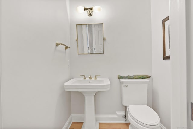21 Oak Ridge Park, Westport, CT 06880 - half bathroom with toilet and wood finished floors
