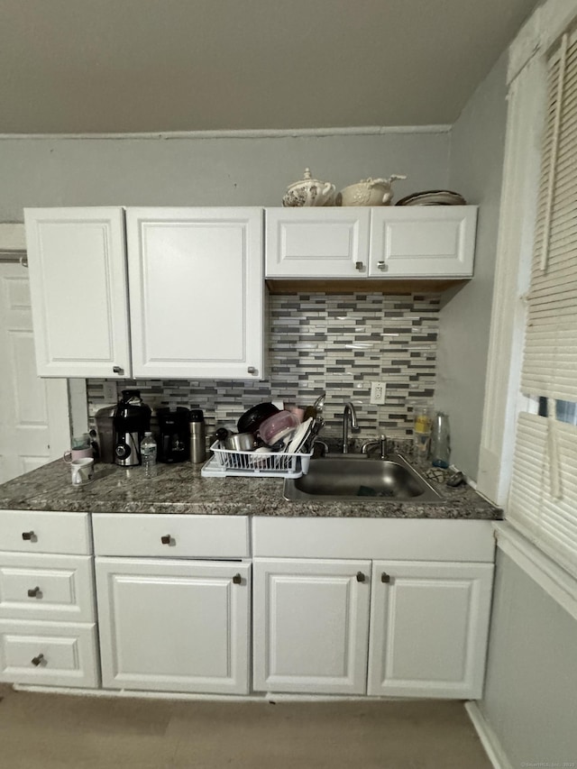 203 S Leonard St, Waterbury, CT 06708 - kitchen featuring a sink, white cabinetry, decorative backsplash, and dark countertops