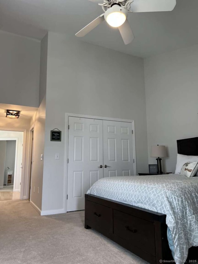 330 Crystal Ave Unit 20, New London, CT 06320 - bedroom with a high ceiling, light colored carpet, a closet, and a ceiling fan