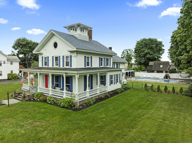 122 College St, Old Saybrook, CT 06475 - back of property featuring a porch, roof with shingles, and a chimney