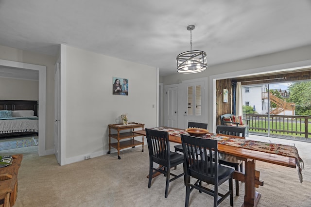 122 College St, Old Saybrook, CT 06475 - dining space featuring light colored carpet and a chandelier
