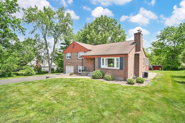 133 Savage Hill Rd, Berlin, CT 06037 - tri-level home featuring a chimney, brick siding, a garage, driveway, and a front lawn