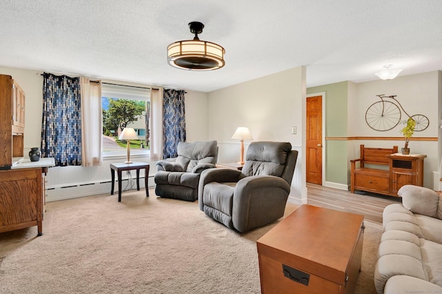 133 Savage Hill Rd, Berlin, CT 06037 - living room featuring a baseboard heating unit, a textured ceiling, and light carpet