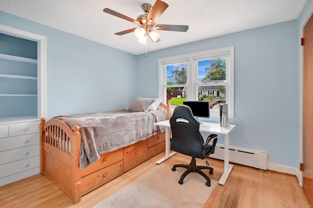133 Savage Hill Rd, Berlin, CT 06037 - bedroom with a baseboard radiator, light wood finished floors, a desk, ceiling fan, and a textured ceiling