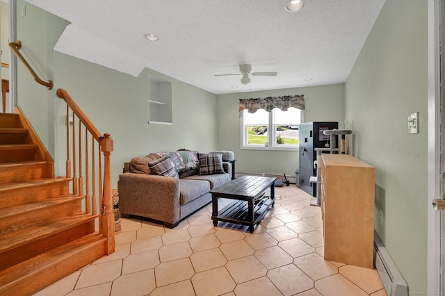 133 Savage Hill Rd, Berlin, CT 06037 - living room with a baseboard heating unit, ceiling fan, stairs, a textured ceiling, and baseboard heating