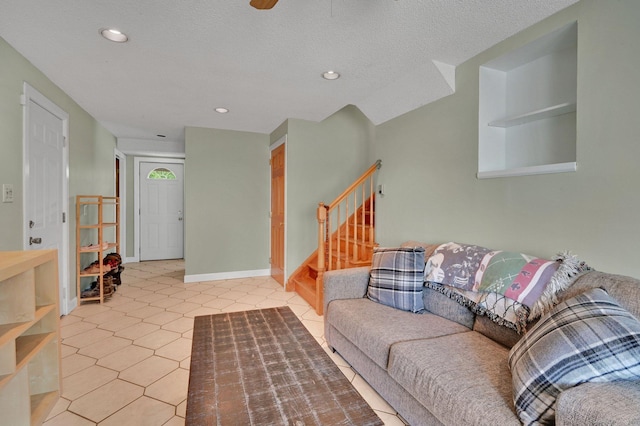 133 Savage Hill Rd, Berlin, CT 06037 - living room featuring stairs, light tile patterned floors, recessed lighting, and a textured ceiling