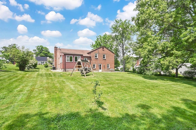 133 Savage Hill Rd, Berlin, CT 06037 - back of house with a chimney and a yard