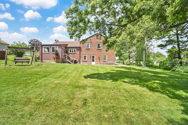 133 Savage Hill Rd, Berlin, CT 06037 - rear view of property featuring a yard, brick siding, and a chimney