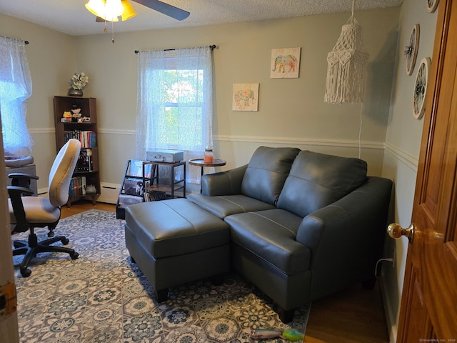 133 Savage Hill Rd, Berlin, CT 06037 - office space with wood finished floors, a ceiling fan, and a baseboard radiator