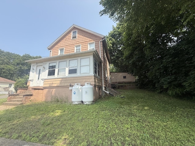 384 Park St, Bristol, CT 06010 - view of front facade with a front lawn